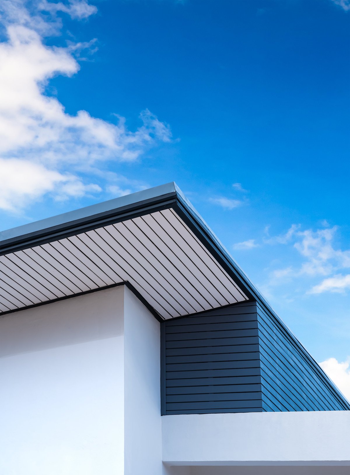 Modern house roof on blue sky daylight