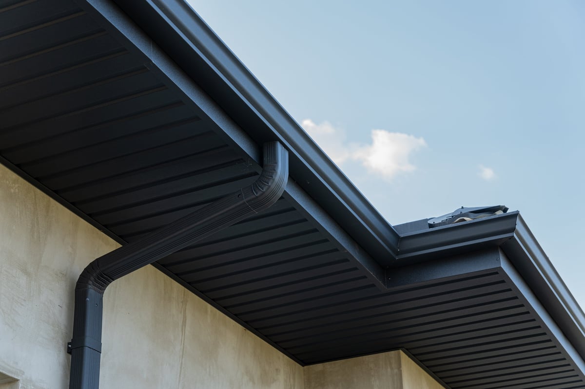 Contemporary home exterior showing a sleek gutter along the roofline
